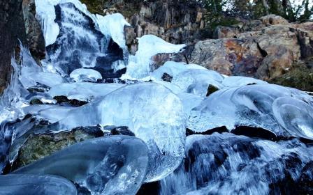 silent forests and past frozen waterfalls 